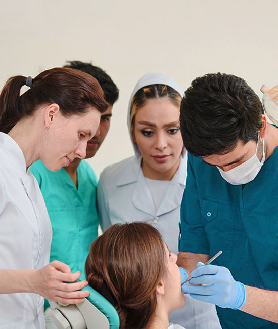 students doing practicum on a patient