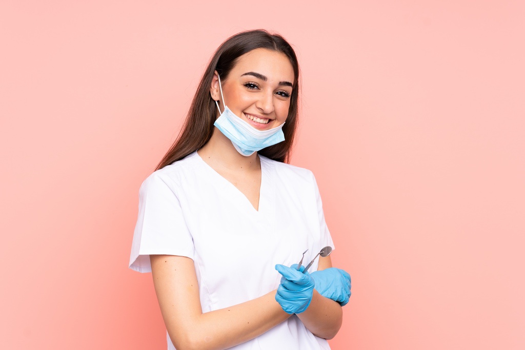 Dental assistant smiling after receiving training