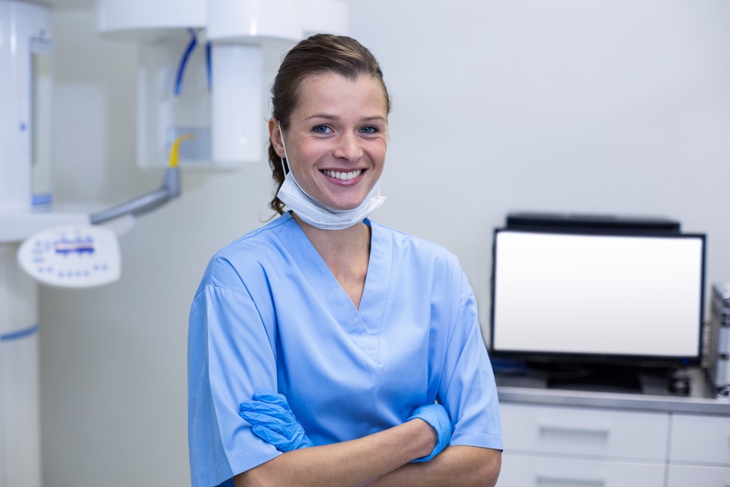 Smiling dental assistant in Canadian practice