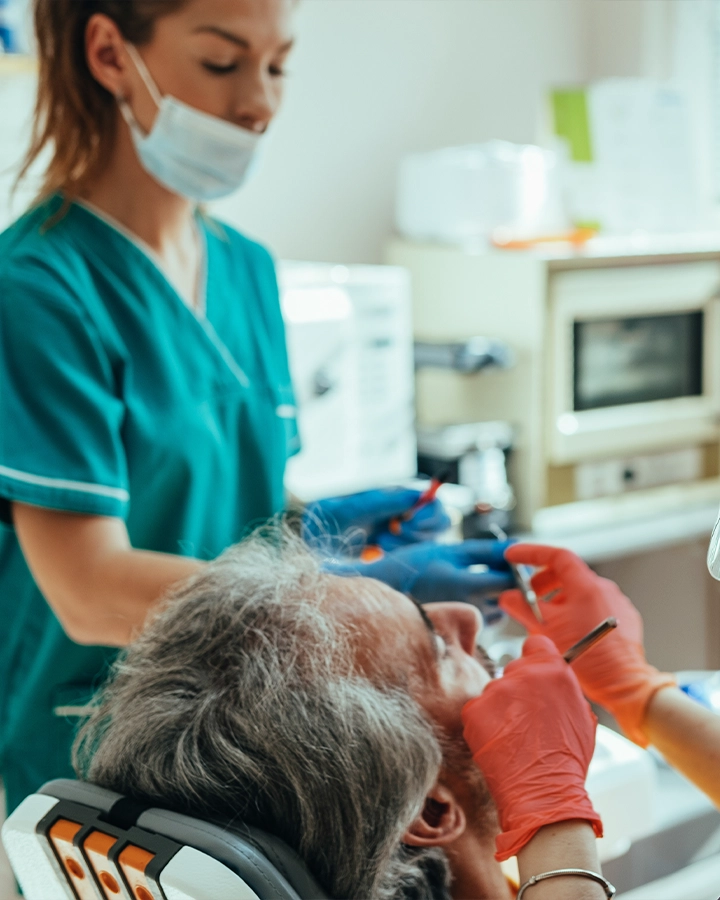 risio-wil-2025-sub-02 dental assistant handing tools to the dentist